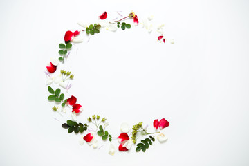 Wedding wreath of rose petals and leaves on white background, composition for decoration