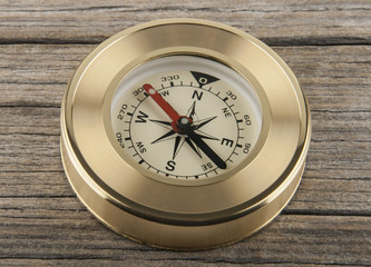 compass on a wooden background