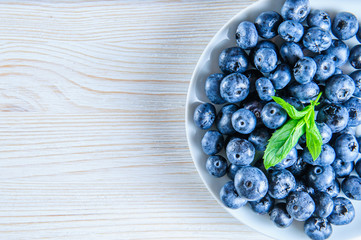 Blueberries with leaves in white background