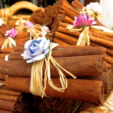cinnamon sticks tied with bow in basket