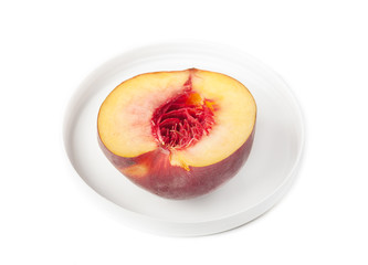 nectarine half on a white grater, without stones, isolate
