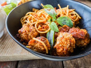 Spaghetti pasta with meatballs and tomato sauce