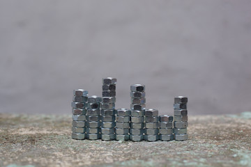 Gray nuts arranged by towers of different heights