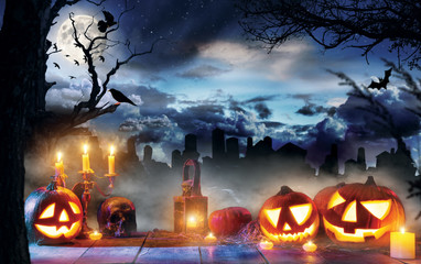 Spooky halloween pumpkins on wooden planks