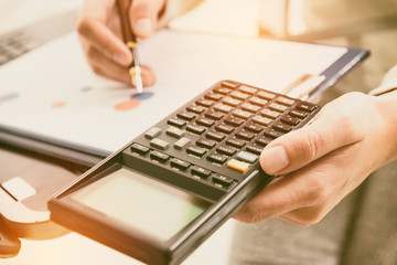 Fototapeta premium Financial chart report concept with calculator