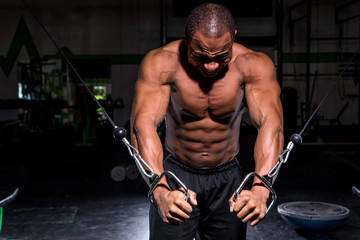 Man doing cable fly at the gym
