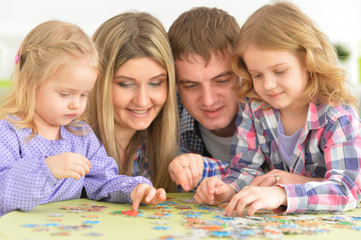 parents playing with daughters