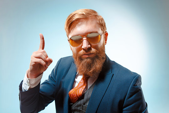 Portrait Of A Business Man Isolated On Blue Background.