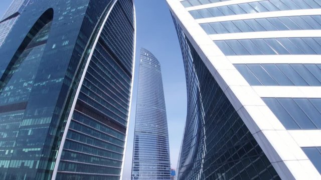 Windows of glass towers. Aerial shot of skyscrapers of Moscow International Business Centre, Moscow-city, 4K