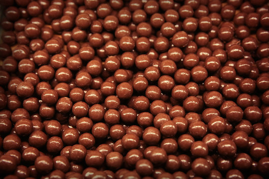 Closeup of chocolate dragees as background
