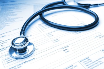 close up stethoscope and medical information form on desk, healthcare technology, medical research diagnosis, medical report record and history patient concept, selective focus, blue color tone