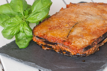 Eggplant parmigiana with basil.