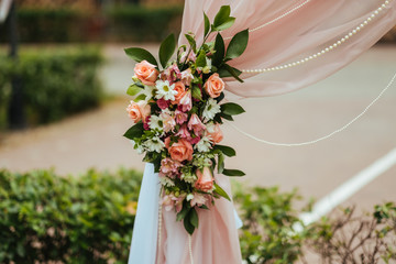 wedding arch with flowers on wedding ceremony. wedding details