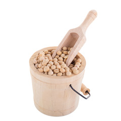 Soybeans in a wooden cup isolated on white background