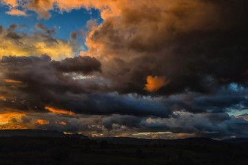 Fototapeta na wymiar Dark storm clouds before rain at sunset. cloud on sunse