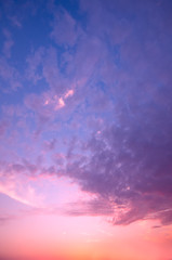 A pink sunset on a summer sky.