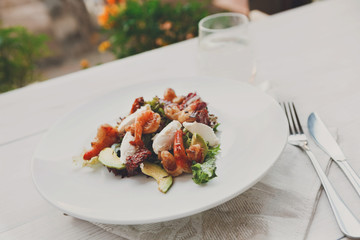 Traditional italian seafood salad with shrimps and mozzarella