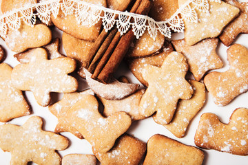 Christmas background with gingerbreads,cinnamon and vintage lace.Holiday,new year concept.Close-up view