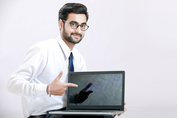 indian man working on laptop