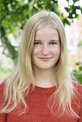 Girl outdor portrait in the green summer garden