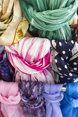 Closeup of colorful scarves. Shallow deep of focus.