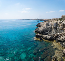 Sea caves of Cavo greco cape. Mediterranean sea landscape