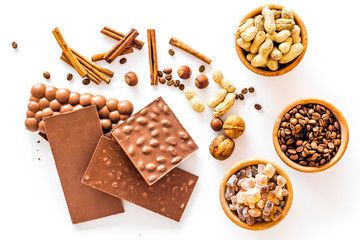 Ingredients for chocolates on white background top view
