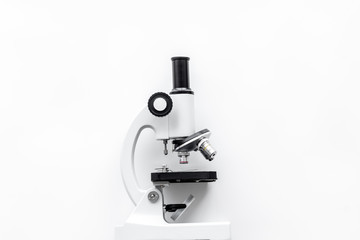 Microscope on white background top view