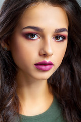 Fototapeta premium Close-up of a Young Woman Getting Spa Treatment. Cosmetic Cream on a Cheek. Skin Care