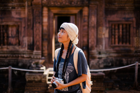 Female traveller at Banteay Srei temple in Siem Reap (Cambodia)