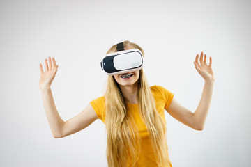 Girl wearing virtual reality goggles.
