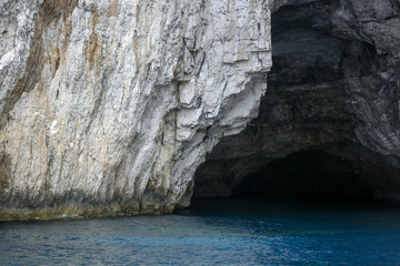 Cave in the azure waters of the Ionian Sea, Greece.