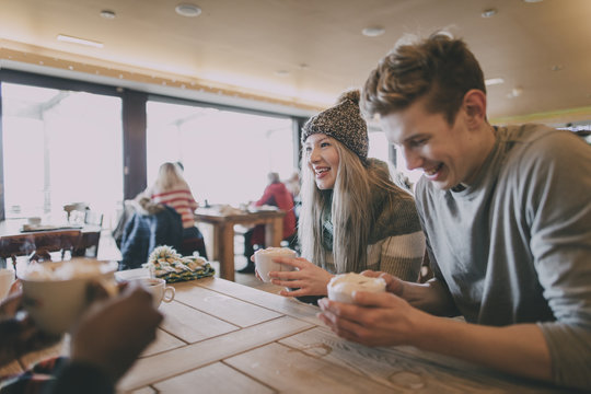 Friends Enjoy Coffee In Winter