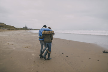 Romantic Stroll On A Winter Beach