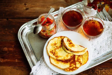 Homemade gluten free pancakes with cottage cheese and honey served on oval plate