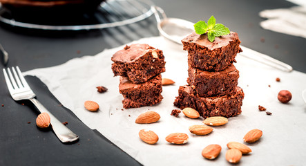 homemade chocolate brownies tower on grey background