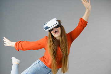 Girl wearing virtual reality goggles.