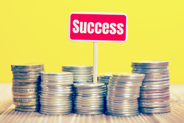 coins on a yellow background, the inscription: "Success"