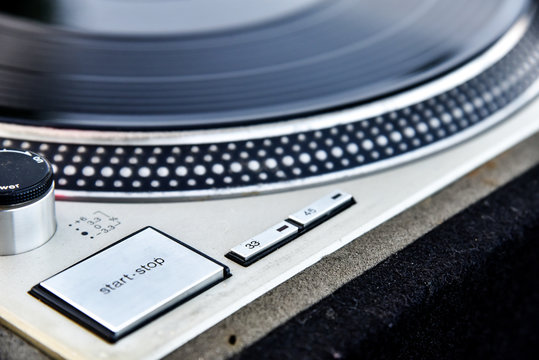 Detail of an old player and vinyl phonograph record