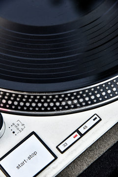 Detail of an old player and vinyl phonograph record