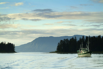 Alaskan Islands at Sunset. Motoring through the southeast Alaskan islands makes for an ideal...