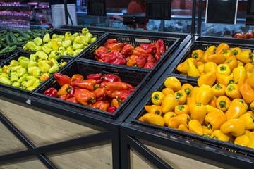 sweet pepper in boxes on the counter