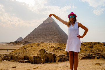 Holding the pyramid in Cairo, Egypt