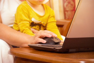 Fototapeta premium Old woman with laptop. Senior grandmother indoors with notebook. Web surfing and shopping on the Internet. Social networks. Difficulties of mastering the computer