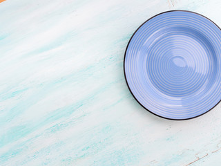 Fototapeta na wymiar Pastel Color blue purple ceramic plate dish top view background