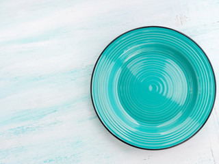 Fototapeta na wymiar Pastel Color turquoise ceramic plate dish top view background