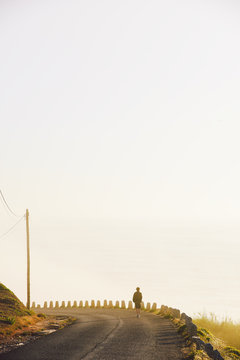 Young man walking solo in the sunlight