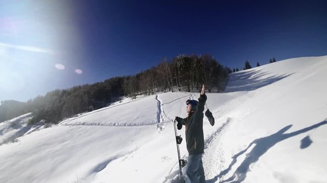 Footage of snowboarder man adventure, walking to snowy alps mountains