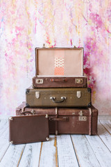 pyramid of several vintage suitcases