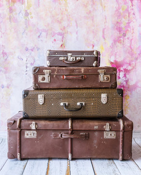 pyramid of several vintage suitcases